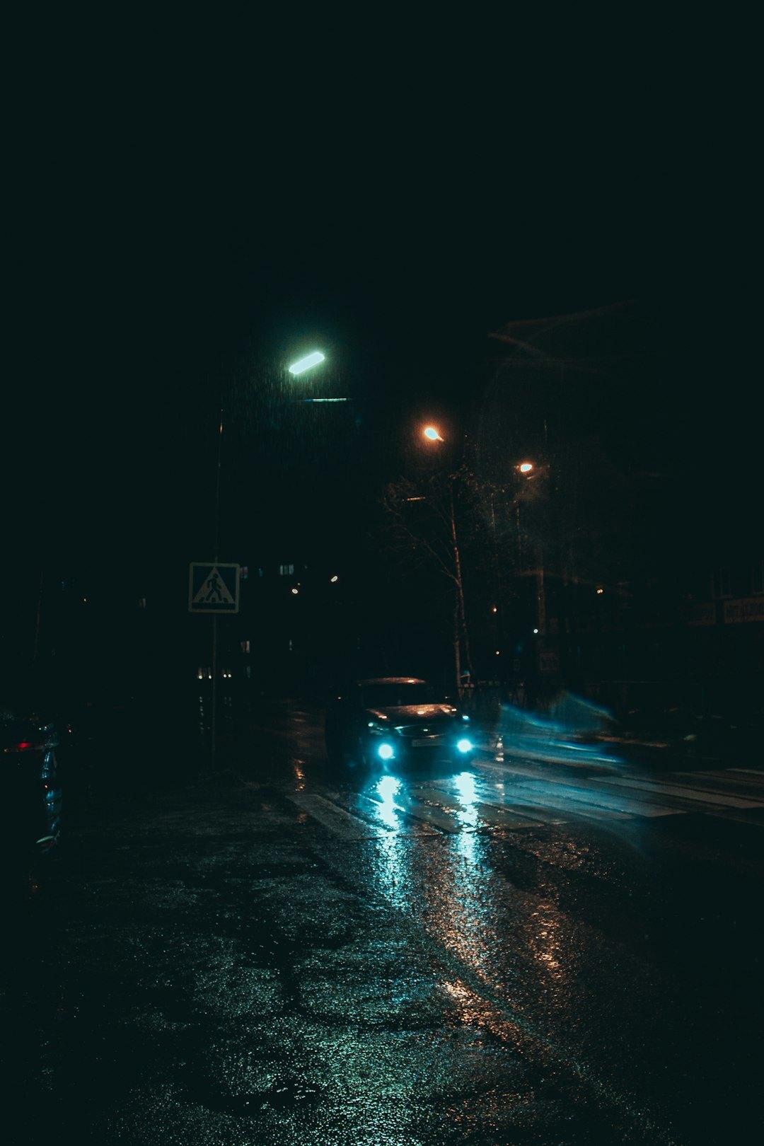 rainy city street at night
